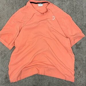 Orange gymshark crest‎ logo tshirt